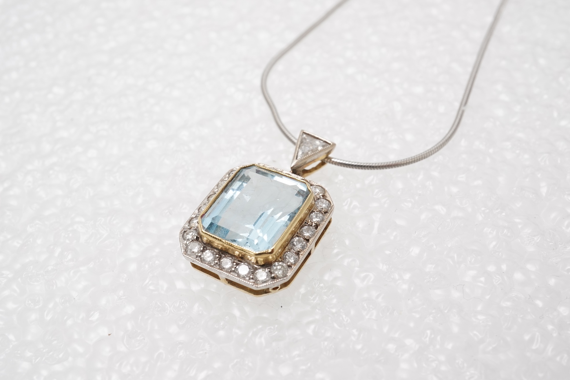 An aquamarine and diamond pendant